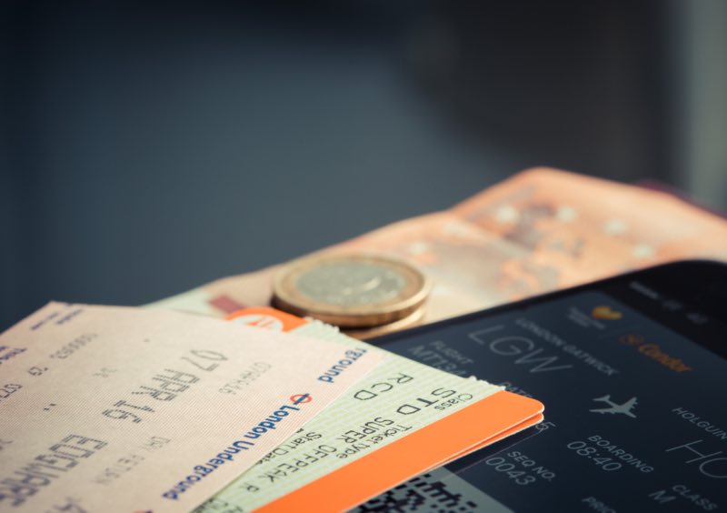 Orange and Green Label Airplane Ticket and Money