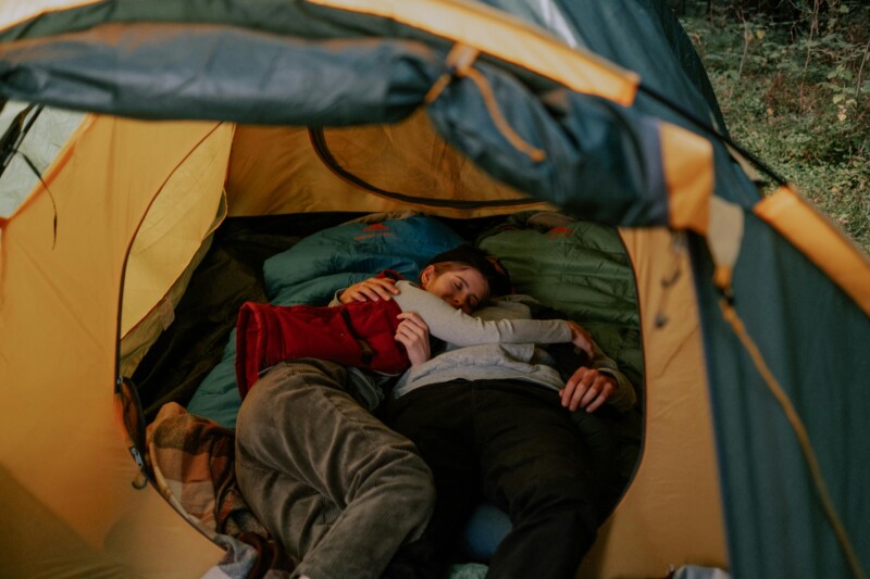 Couple sleeping inside a tent