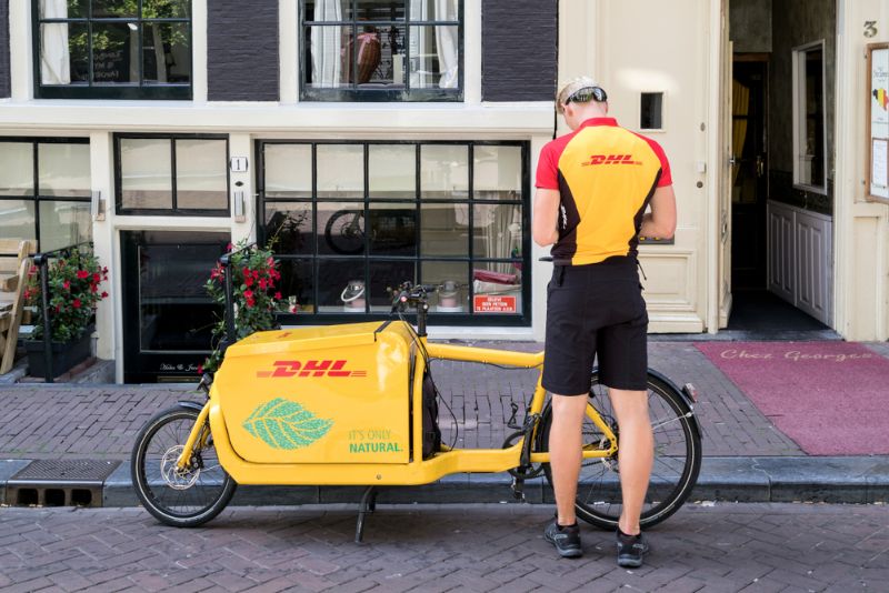 DHL courier with freight bicycle