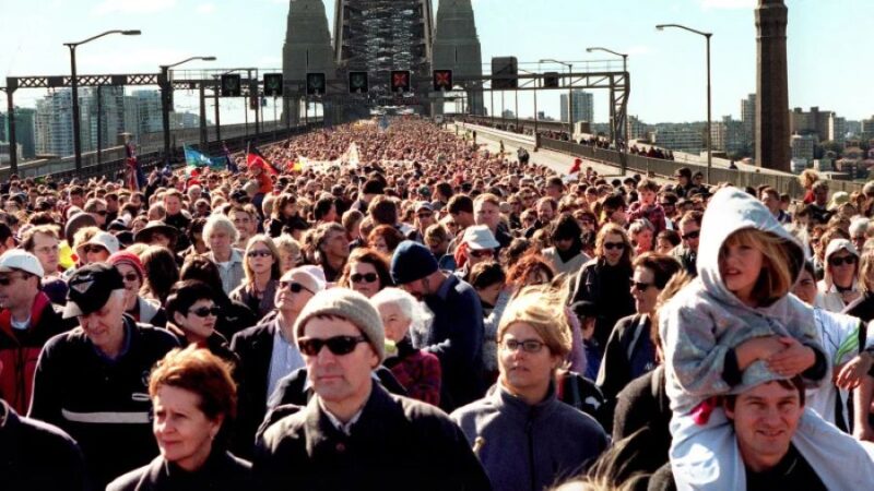 What should you bring when walking over the Sydney Harbour Bridge?