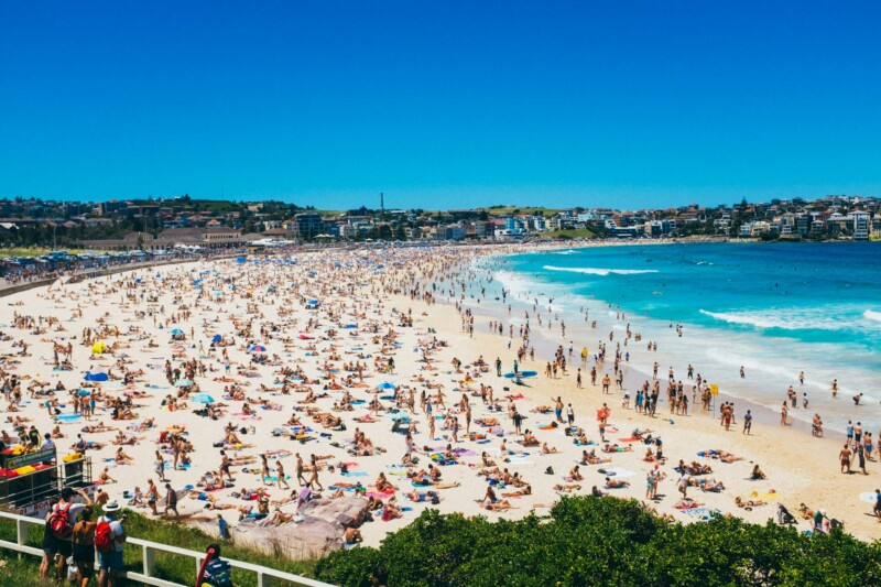 What are the best neighborhoods in Sydney, Australia for young professionals? 4 Sunbathers and swimmers on Bondi Beach