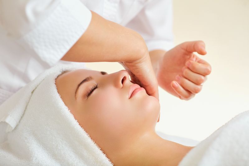 Beautiful woman at a facial massage at a spa salon