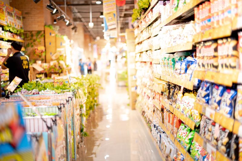 Shelves in a supermarket full of grocery items