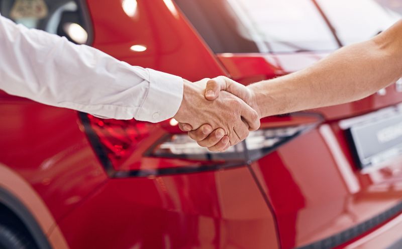 Handshake over a car deal