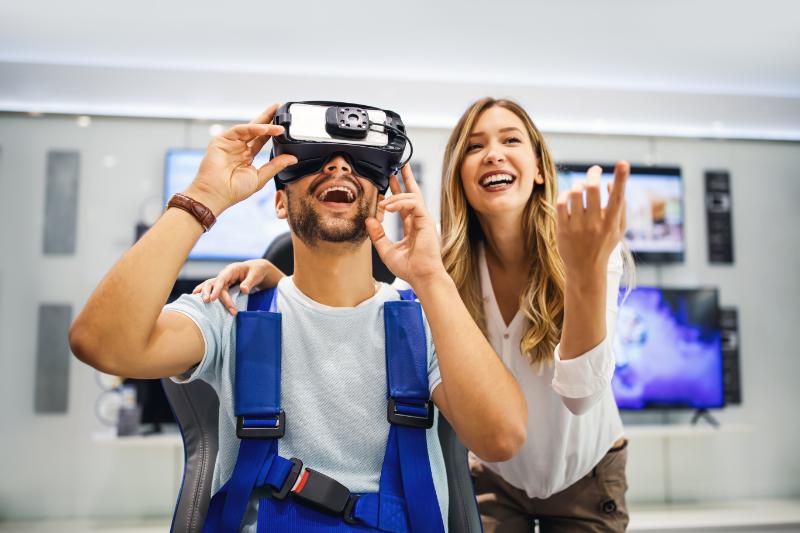 Couple playing VR game at home