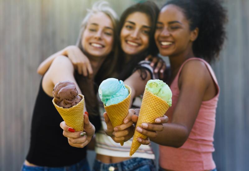 Friends showing off their ice creams