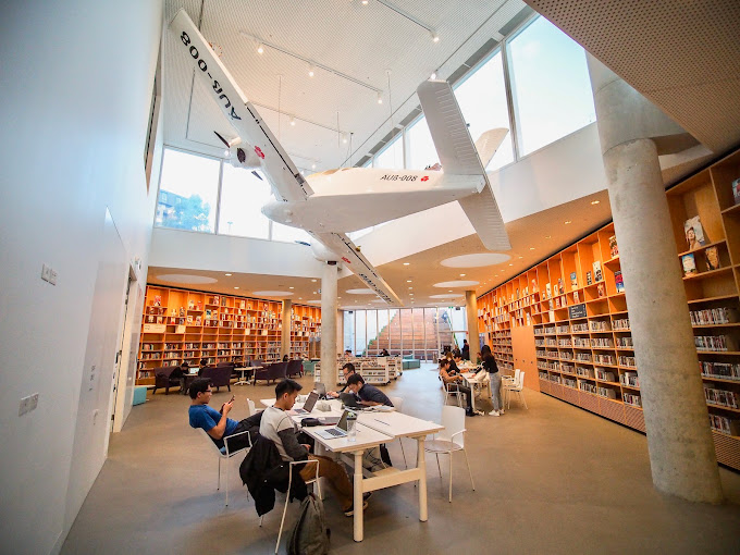 Well-lit Green Square Library filled with library goers