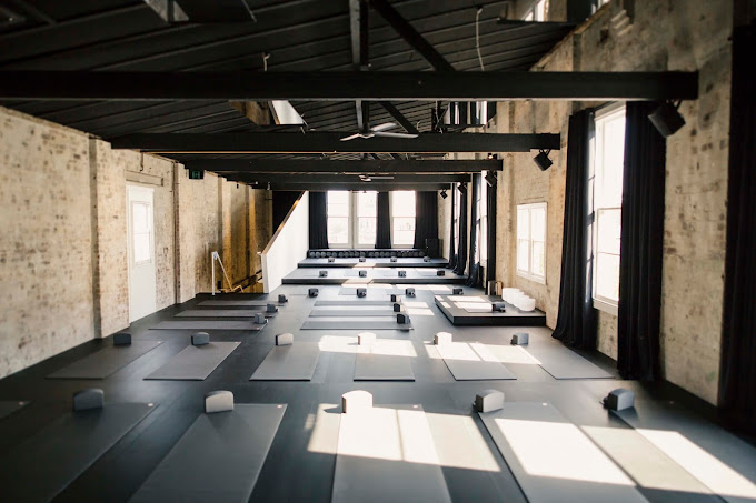 Empty yoga room at Humming Puppy Yoga Sydney