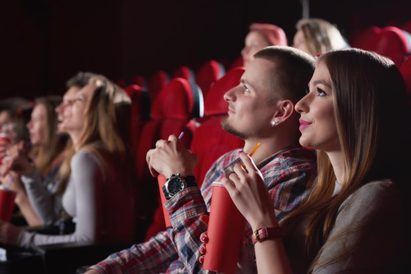 Happy couple watching cinema