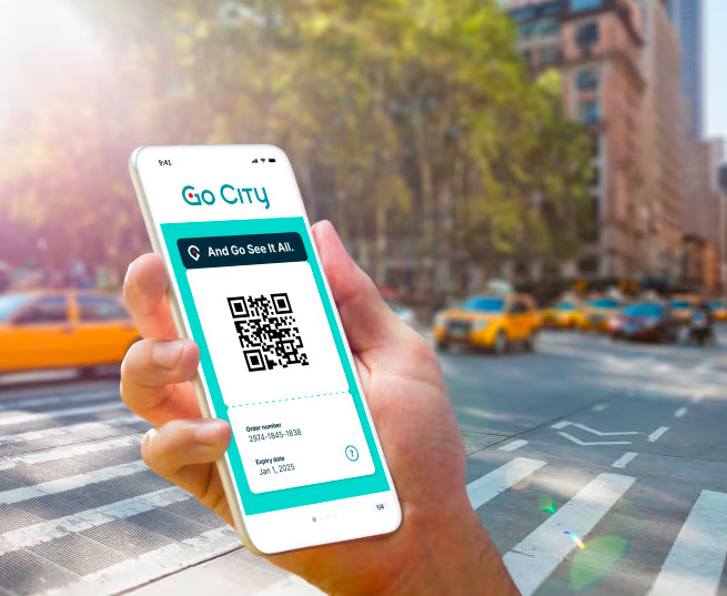 Hand holding a smartphone with GoCity app QR code