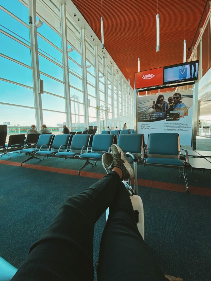 Man taking a nap at airport