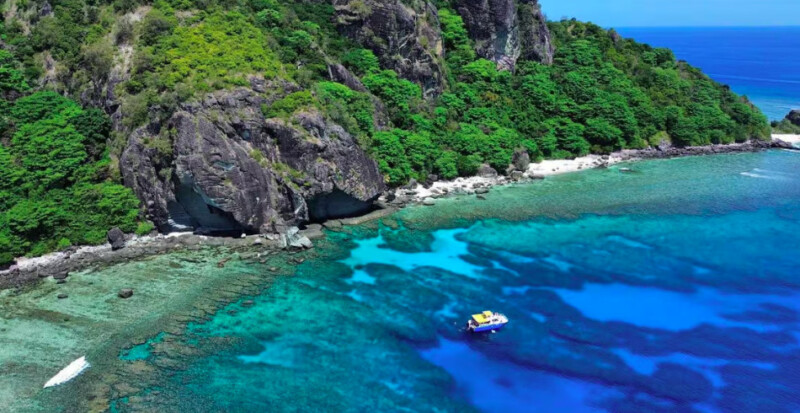 Solitary boat shown from a drone shot from Fiji Islands