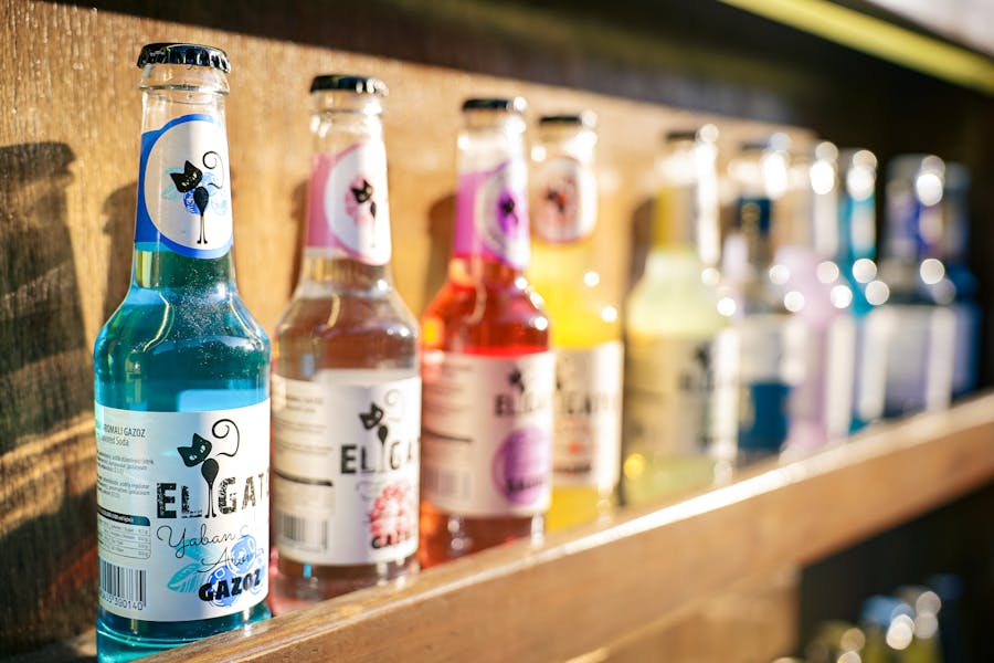 What were the popular wine coolers in the 80s? 1 Colorful Array of Bottled Beverages on Shelf